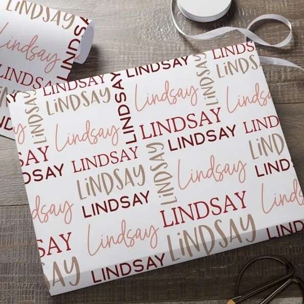 Personalized Gift paper with recipient's name printed on it.
